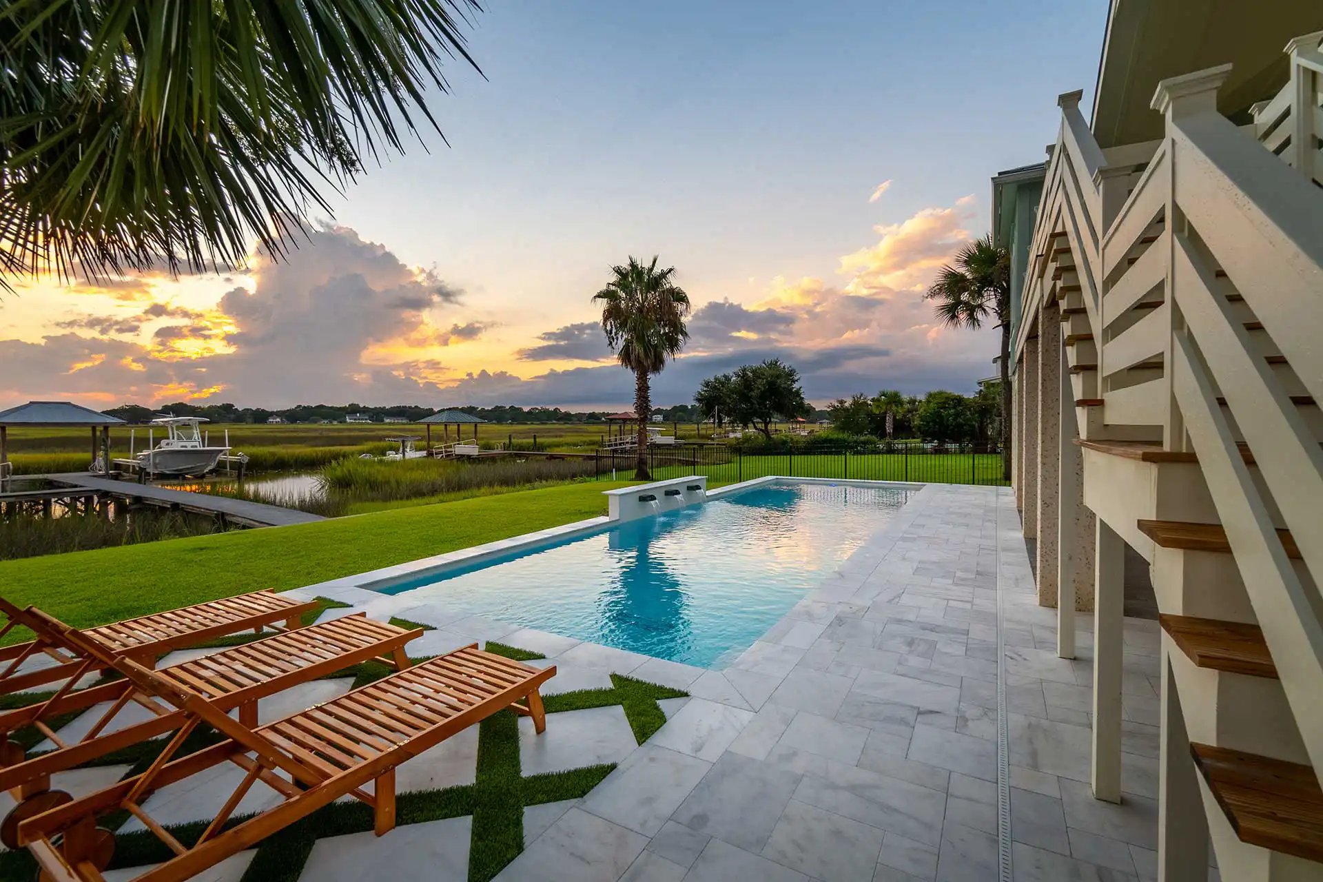 Waterfront pool at sunset — Heritage Pools project