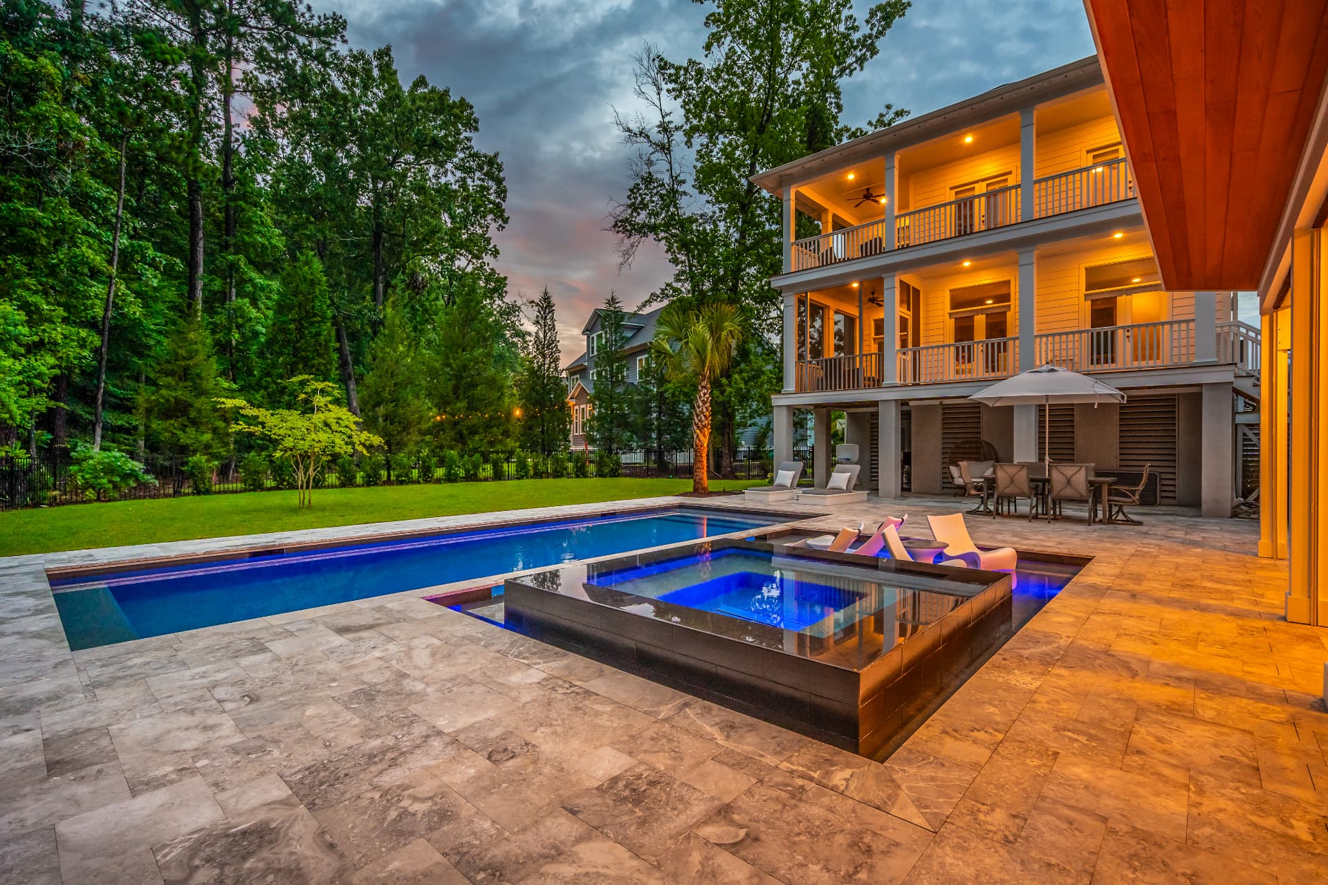 Raised spa, travertine deck — Heritage Pools project